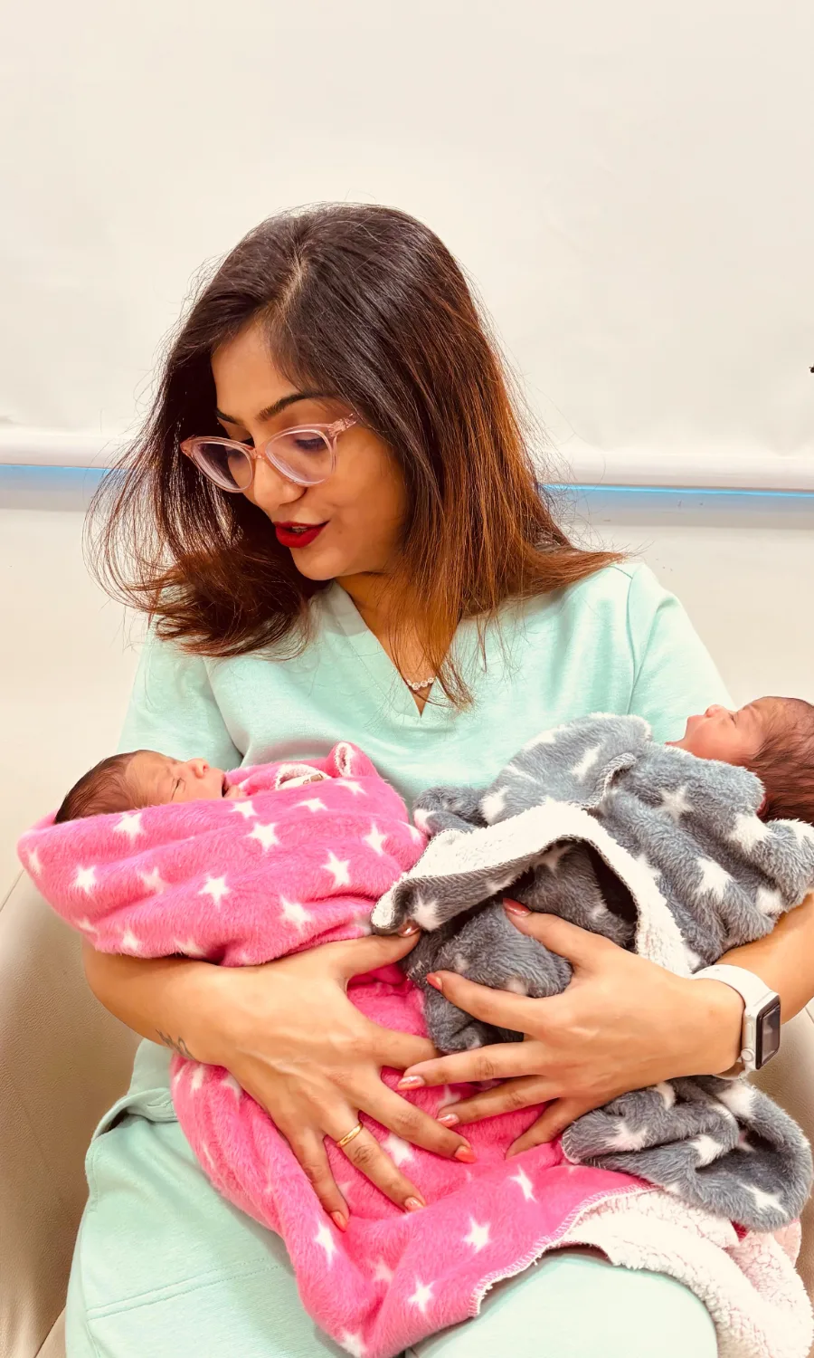 Dr. Rashmi Bhamare holding two newborn babies