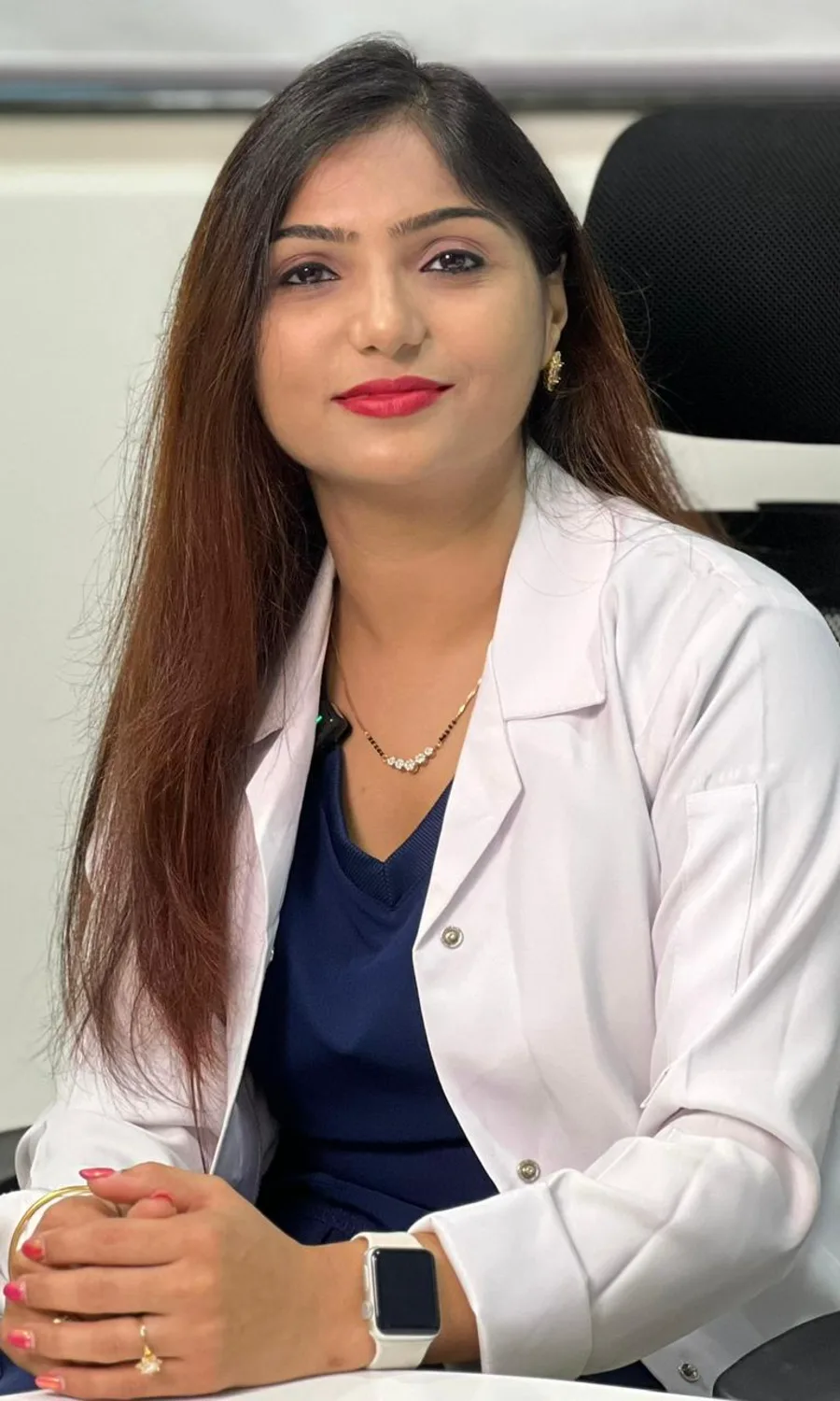 Dr. Rashmi Bhamare in her white coat, seated at her desk
